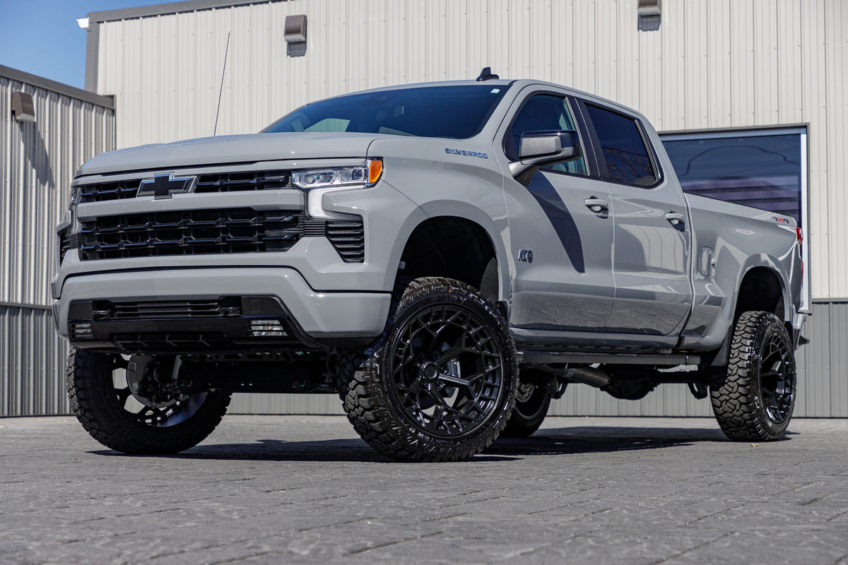 2024 Chevrolet Silverado 1500 with a 6" Rough Country lift kit, 22x12 Fuel Charger wheels, and 35" Fury Country Hunter R/T tires.
