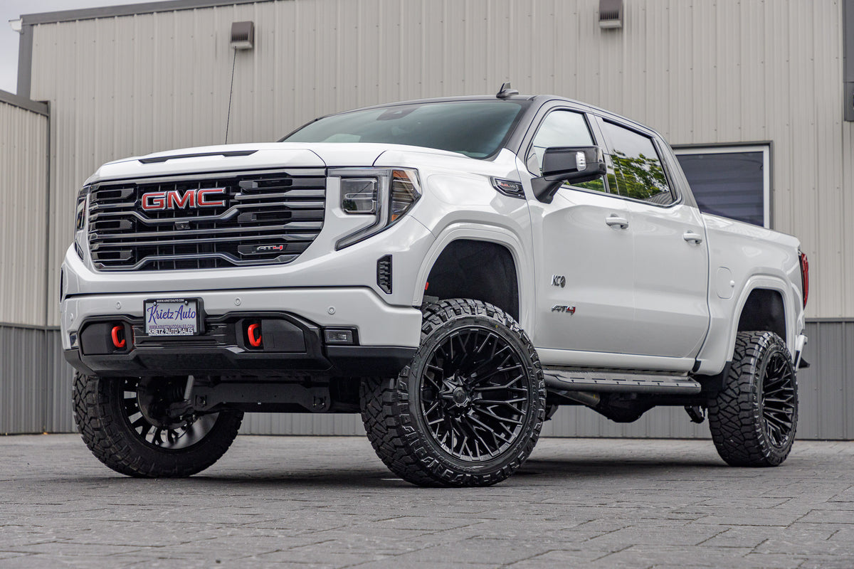 2022 GMC Sierra 1500 AT4 White with 6 inch rough country lift kit and 22x12 fuel strike wheels and 35" Nitto Ridge Grappler Tires