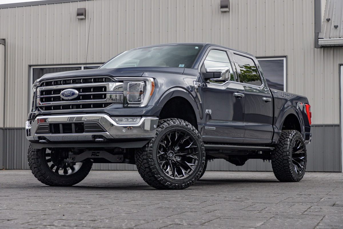 2021 Ford F-150 Lariat Blue with 6 inch rough country lift kit and 22x12 Fuel flame wheels and 35 inch nitto ridge grappler tires