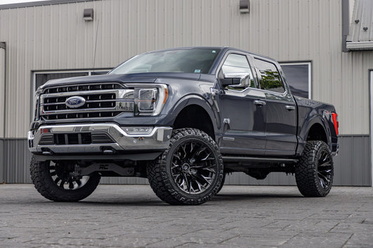 2021 Ford F-150 Lariat Blue with 6 inch rough country lift kit and 22x12 Fuel flame wheels and 35 inch nitto ridge grappler tires