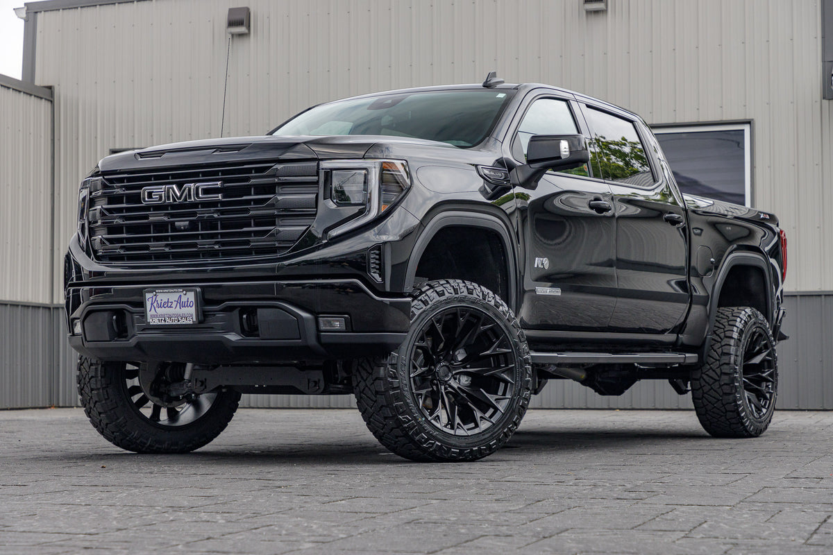 2023 GMC Sierra 1500 Elevation black with 6 inch rough country lift kit and 22x12 fuel flame wheel and 35 inch nitto ridge grappler tires
