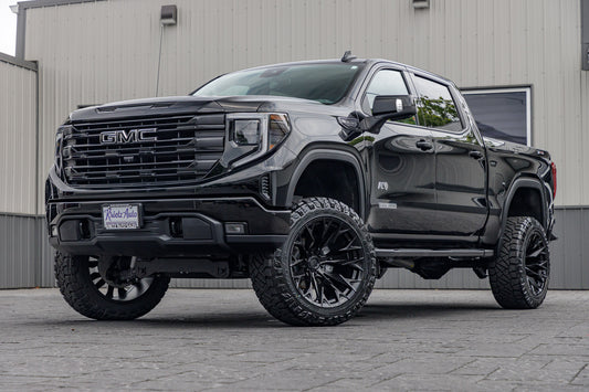 2023 GMC Sierra 1500 Elevation black with 6 inch rough country lift kit and 22x12 fuel flame wheel and 35 inch nitto ridge grappler tires