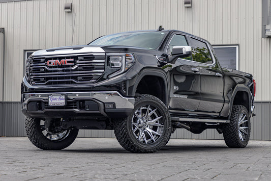 2024 GMC Sierra 1500 SLT Black with 6 inch rough country lift kit and 22x12 fuel catalyst wheels and 35 inch fuel gripper M/T tires