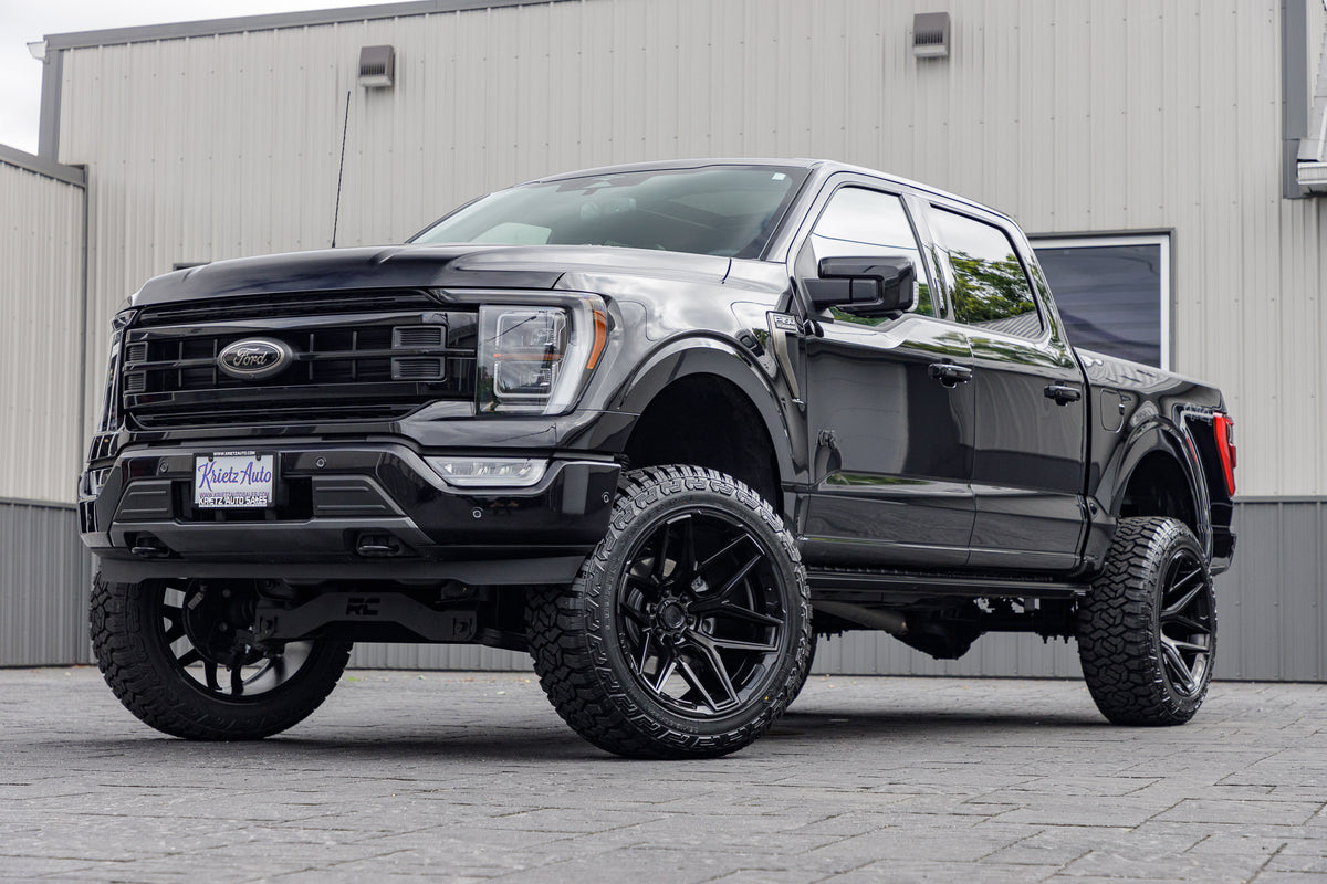 2023 Ford F-150 Platinum black with 6 inch rough country lift kit with 22x12 fuel flux wheels and 35 inch fury country hunter R/T tires