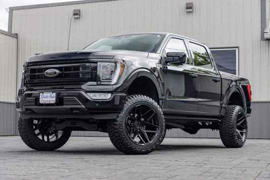 2023 Ford F-150 Platinum black with 6 inch rough country lift kit with 22x12 fuel flux wheels and 35 inch fury country hunter R/T tires