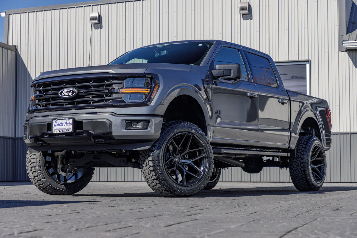 2024 Ford F-150 XLT with a 6" Rough Country lift kit, 22x12 Fuel Flux wheels, and 35" Fury Country Hunter R/T tires.