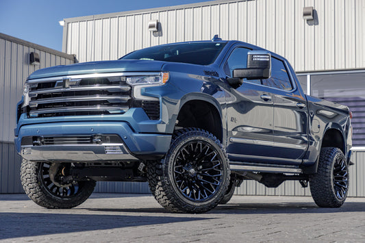 2024 Chevrolet Silverado 1500 High Country with a 6" Rough Country lift kit, 22x12 Fuel Strike wheels, and 35" Fury Country Hunter R/T tires.