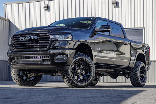 2025 Ram 1500 Laramie with a 6" Rough Country lift kit, 22x12 4 Play 4P06 wheels, and 35" Fury Country Hunter R/T tires.