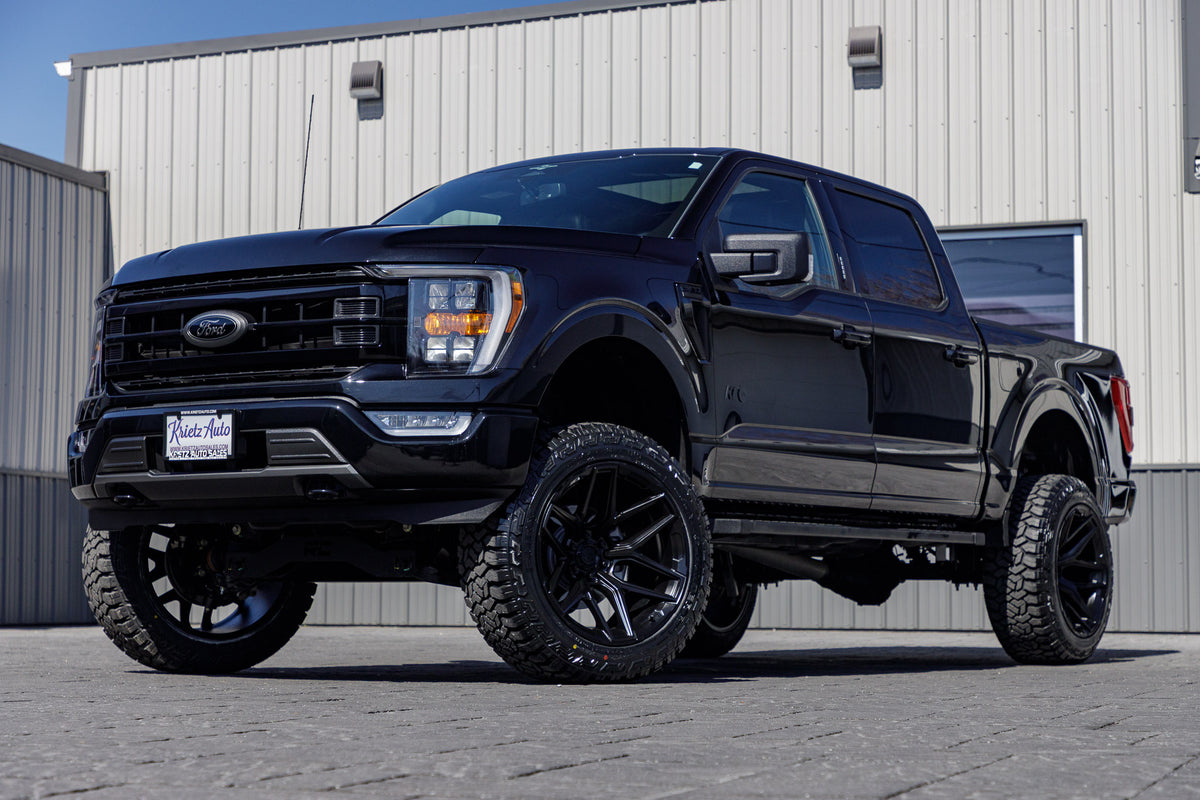 2023 Ford F-150 XLT with a 6" Rough Country lift kit, 22x12 Fuel Flux wheels, and 35" Fury Country Hunter R/T tires.