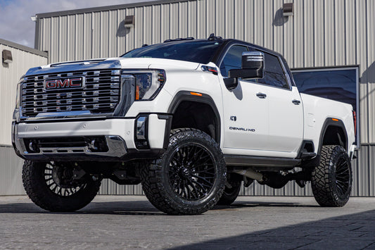 2024 GMC Sierra 2500 Denali with a 5" BDS lift kit, 22x12 TIS 566B wheels, and 37" Nitto Ridge Grappler tires.