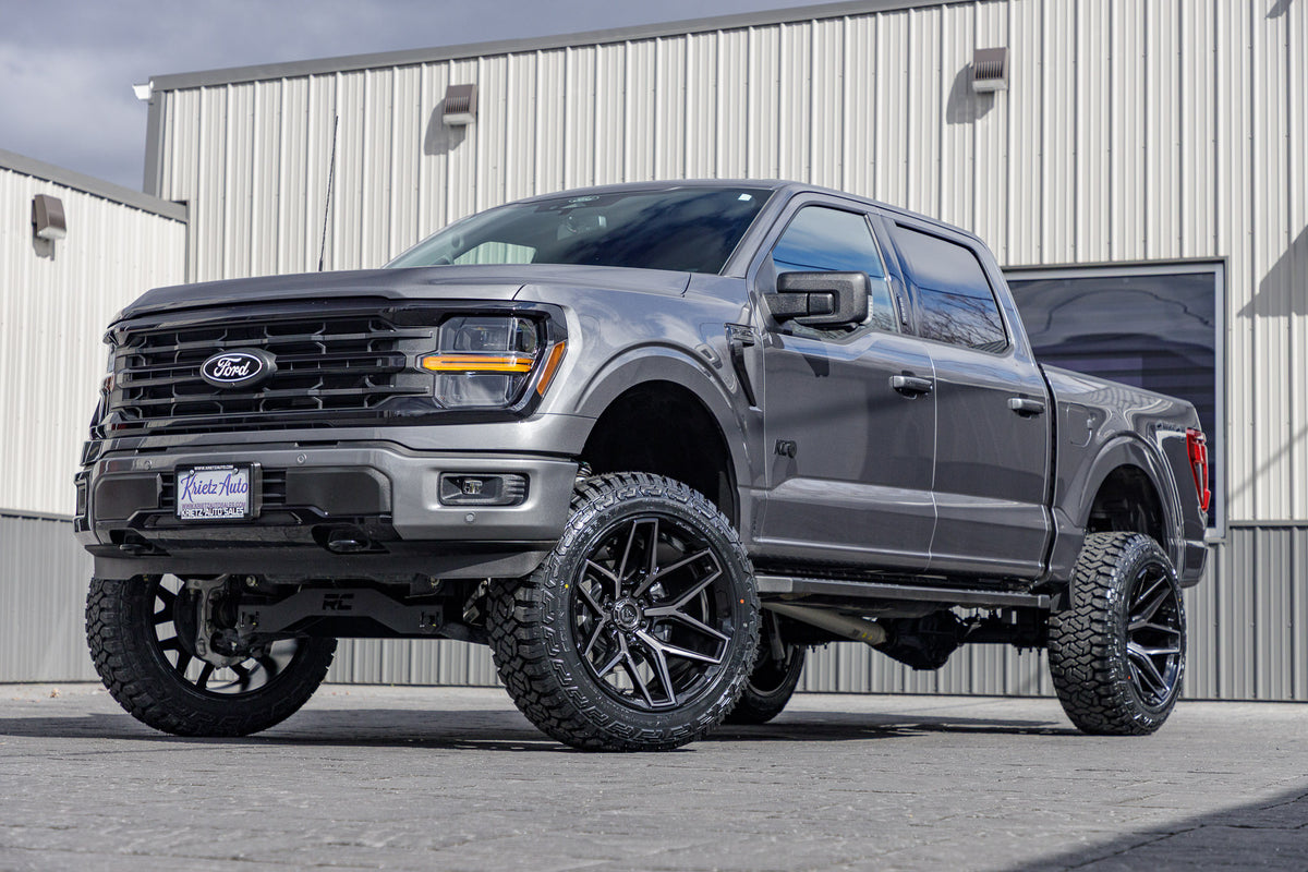 2024 Ford F-150 XLT with a 6" Rough Country lift kit, 22x12 Fuel Flux wheels, and 35" Fury Country Hunter tires.