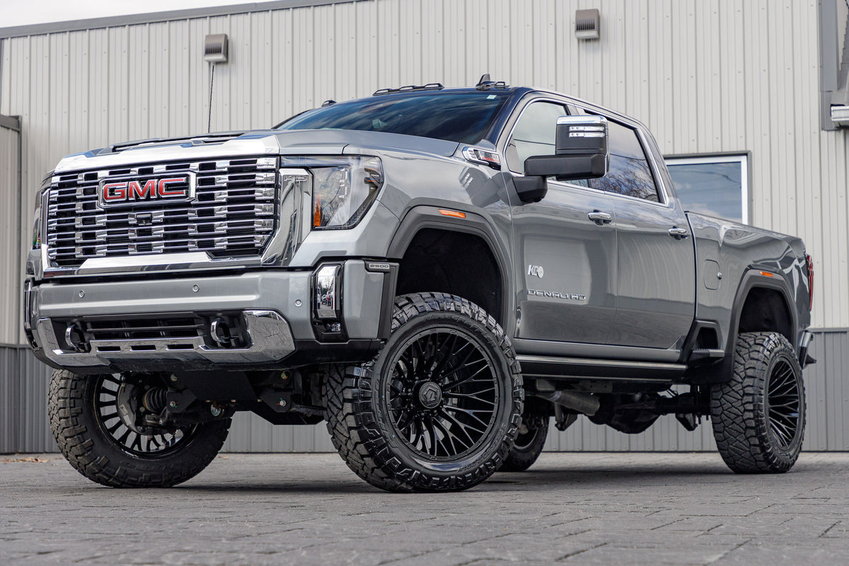 2024 GMC Sierra 2500 Denali with a 5" BDS lift kit, 22x12 TIS 566B wheels, and 37" Nitto Ridge Grappler tires.