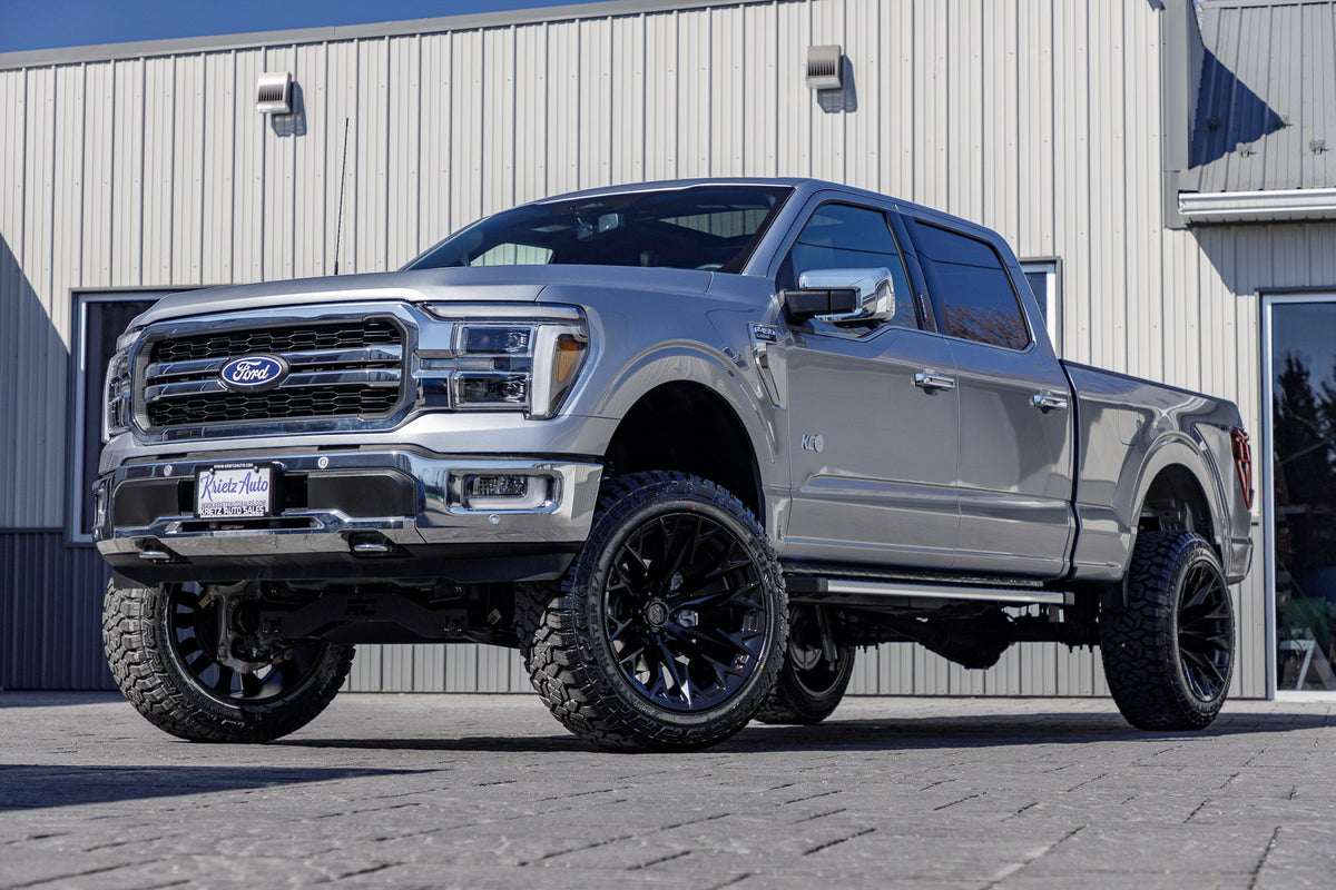 2024 Ford F-150 Lariat with a 6" Rough Country lift kit, 22x12 Fuel Flame wheels, and 35" Fury Country Hunter R/T tires.