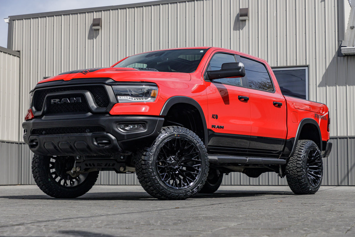 2024 Ram 1500 Rebel with a 6" Rough Country lift kit, 22x12 Fuel Strike wheels, and 35" Fury Country Hunter R/T tires.