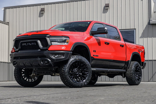 2024 Ram 1500 Rebel with a 6" Rough Country lift kit, 22x12 Fuel Strike wheels, and 35" Fury Country Hunter R/T tires.