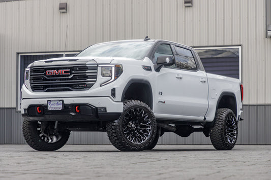 2024 GMC Sierra 1500 AT4 with a 6" Rough Country lift kit, 22x12 Fuel Strike wheels, and 35" Fury Country Hunter R/T tires.
