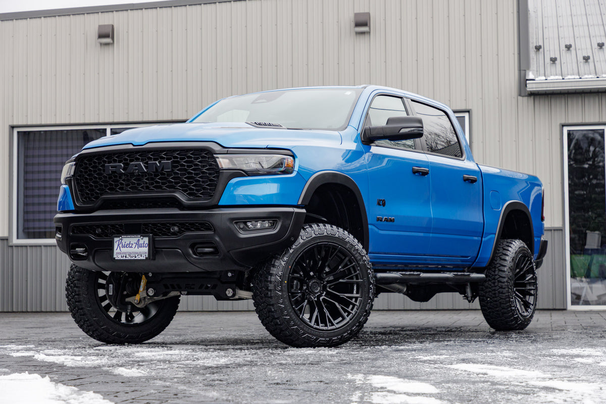 2025 Ram 1500 Rebel with a 6" Rough Country lift kit, 22x12 Fuel Rebar wheels, and 35" Fury Country Hunter R/T tires.