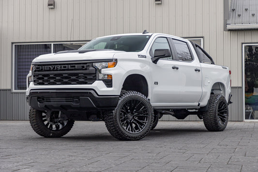 2025 Chevrolet Silverado 1500 Custom Trail Boss with a 6" Rough Country lift kit, 22x12 Fuel Rebar wheels, and 35" Avix Trailtek R/T tires.