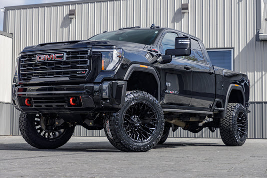 2024 GMC Sierra 2500 AT4 with a 5" BDS lift kit, 22x12 Fuel Strike wheels, and 37" Nitto Ridge Grappler tires.