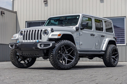 2023 Jeep Wrangler Unlimited Sahara 4XE with a 2.5" Rough Country lift kit, 22x12 Fuel Flux wheels, and 35" Fury Country Hunter R/T tires.