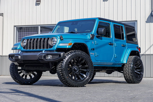 2024 Jeep Wrangler Sport S 4XE with a 2.5" Rough Country lift kit, 22x12 Fuel Blitz wheels, and 35" Fury Country Hunter R/T tires.