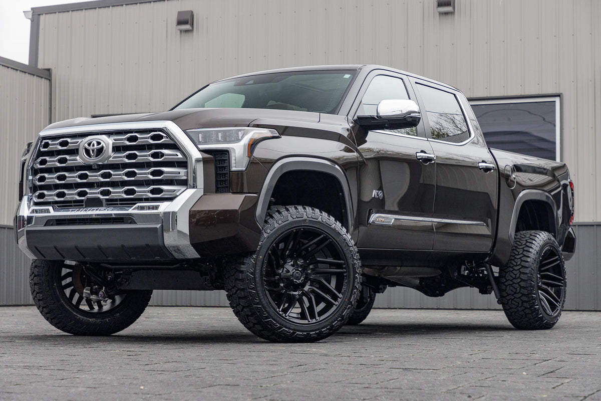 2024 Toyota Tundra Platinum with a 6" Rough Country lift kit, 22x12 Fuel Typhoon wheels, and 35" Fury Country Hunter R/T tires.