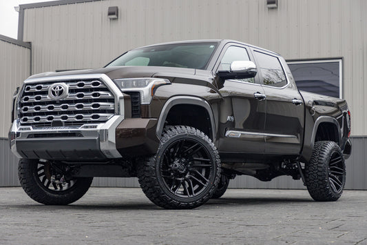 2024 Toyota Tundra Platinum with a 6" Rough Country lift kit, 22x12 Fuel Typhoon wheels, and 35" Fury Country Hunter R/T tires.