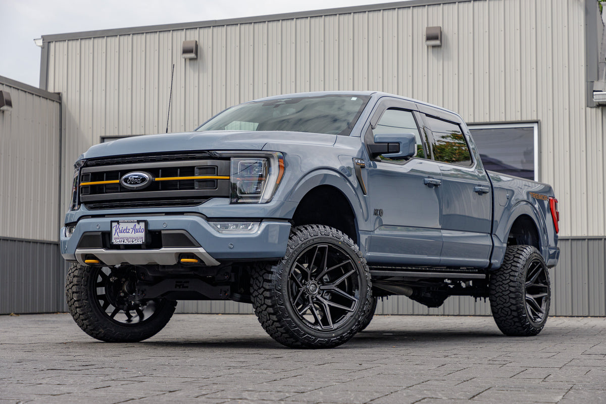 2023 Ford F-150 XLT with a 6" Rough Country lift kit, 22x12 Fuel Flux wheels, and 35" Fury Country Hunter R/T tires.