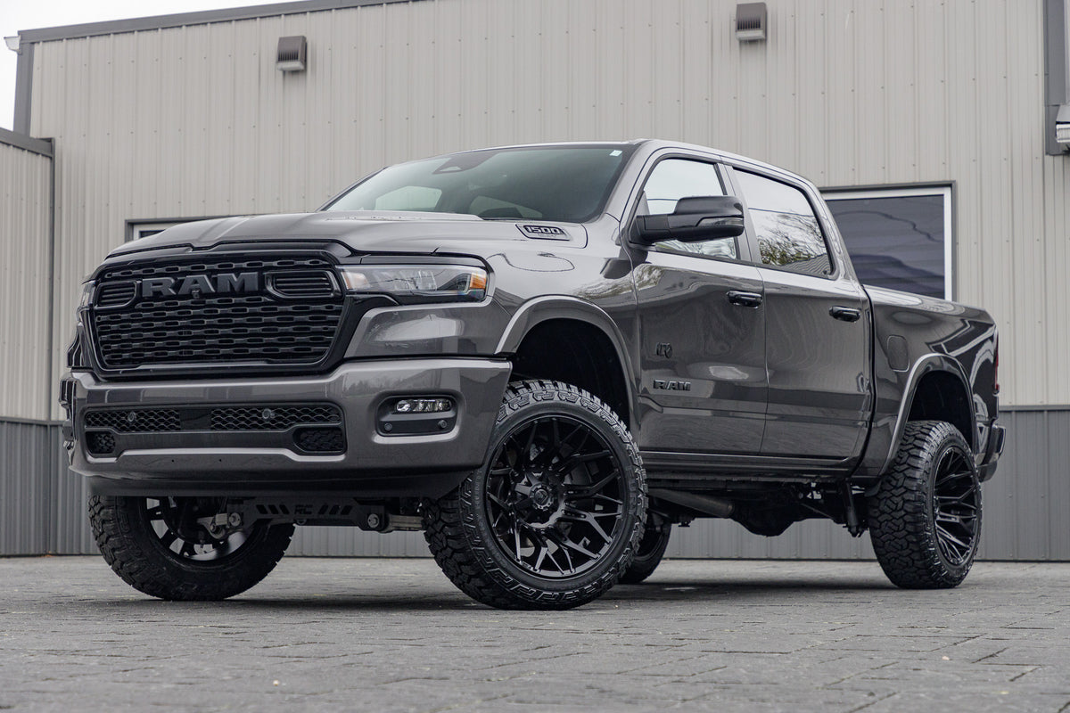2025 Ram 1500 Big Horn with a 6" Rough Country lift kit, 22x12 Fuel Twitch wheels, and 35" Fury Country Hunter R/T tires.
