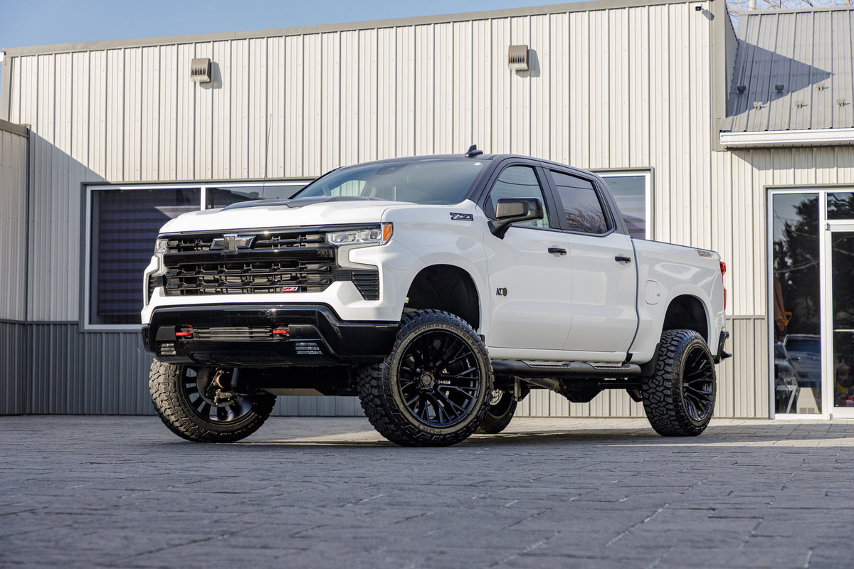 2025 Chevrolet Silverado 1500 LT Trail Boss with a 6" Rough Country lift kit, 22x12 Fuel Rebar wheels, and 35" Fury Country Hunter R/T tires.