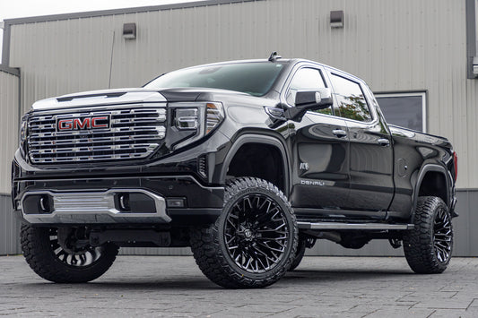 2022 GMC Sierra 1500 Denali with a 6" Rough Country suspension kit, 22x12 Fuel Strike wheels, and 35" Fury Country Hunter R/T tires.