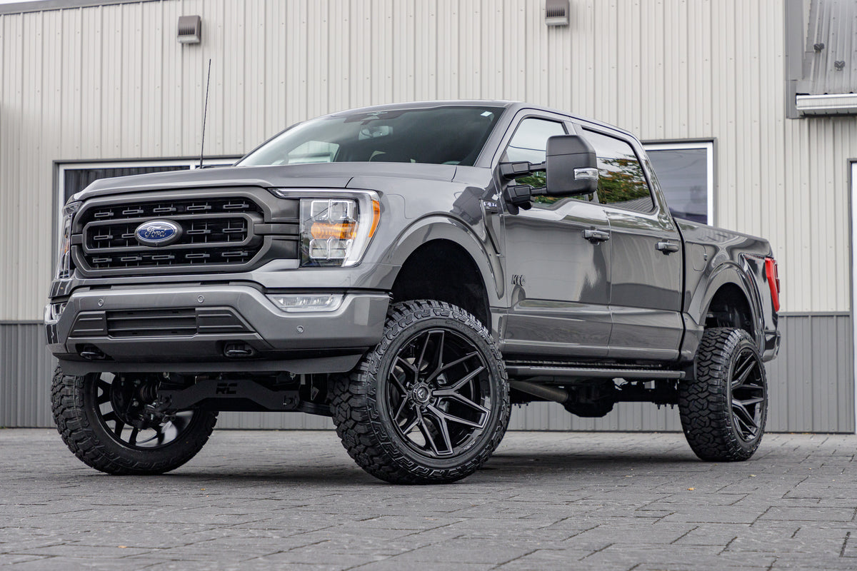 2023 Ford F-150 XLT with a 6" Rough Country lift kit, 22x12 Fuel Flux wheels, and 35" Fury Country Hunter R/T tires.