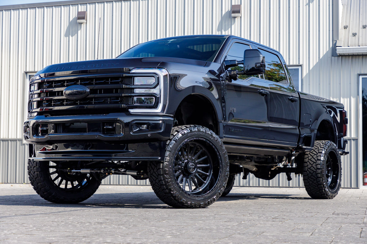 2023 Ford F-250 Super Duty Platinum with a 6" Wicked lift kit, 24x12 American Force Battery wheels, and 35" Fury Country Hunter R/T tires.