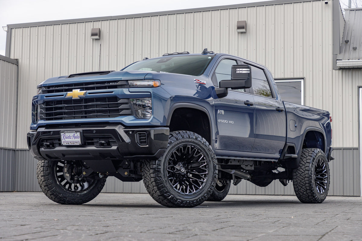 2025 Chevrolet Silverado 2500 Custom with a 5" BDS lift kit, 22x12 Fuel Strike wheels, and 37" Nitto Ridge Grappler tires.