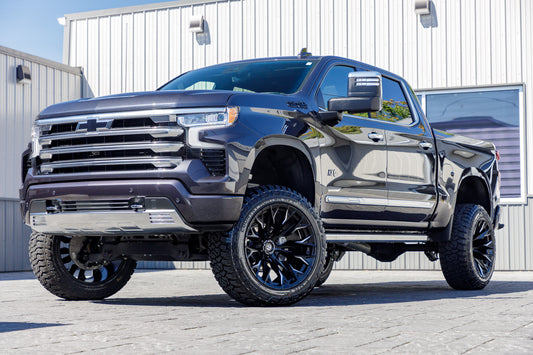 2023 Chevrolet Silverado 1500 High Country with a 6" Rough Country suspension kit, 22x12 Fuel Flame wheels, and 35" Fury Country Hunter R/T tires.