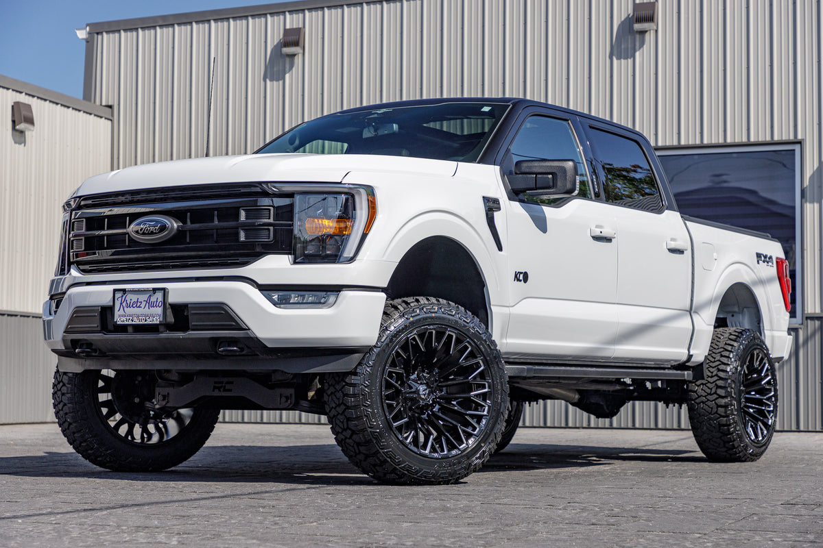 2023 Ford F-150 XLT with a 6" Rough Country lift kit, 22x12 Fuel Strike wheels, and 35" Fury Country Hunter R/T tires.