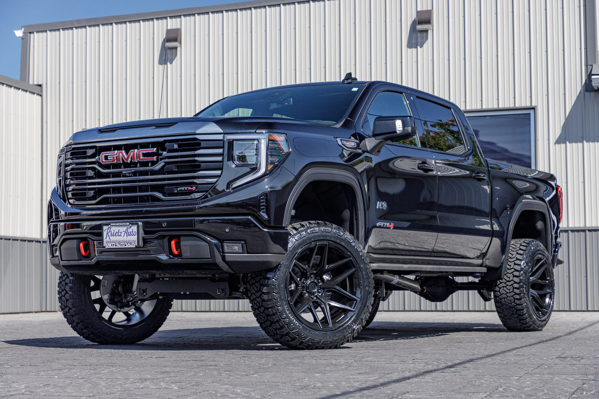 2024 GMC Sierra 1500 AT4 with a 6" Rough Country lift kit, 22x12 Fuel Flux wheels, and 35" Fury Country Hunter R/T tires.