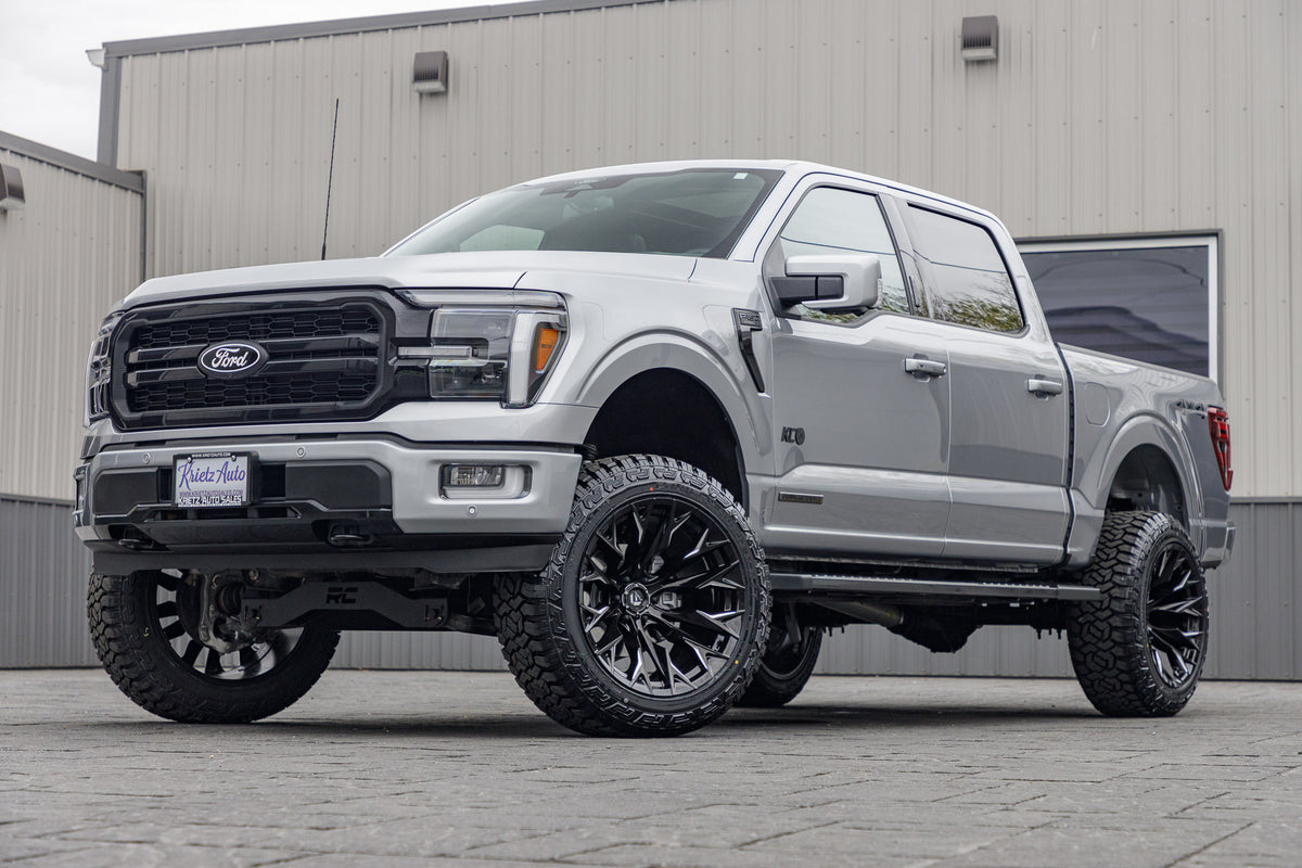 2024 Ford F-150 Lariat with a 6" Rough Country lift kit, 22x12 Fuel Flame wheels, and 35" Fury Country Hunter R/T tires.