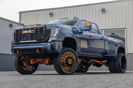 2025 GMC Sierra 3500HD Denali Ultimate with a 7" McGaughys lift kit, 26x8.25 JTX Forged Empire wheels, and 37" Fury Country Hunter M/T tires.