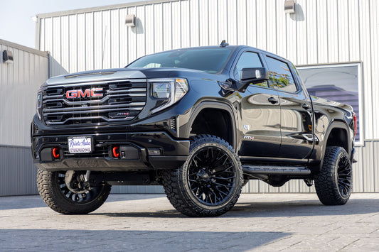 2024 GMC Sierra AT4 with a 6" Rough Country lift kit, 22x12 Fuel Strike wheels, and 35" Fury Country Hunter R/T tires.
