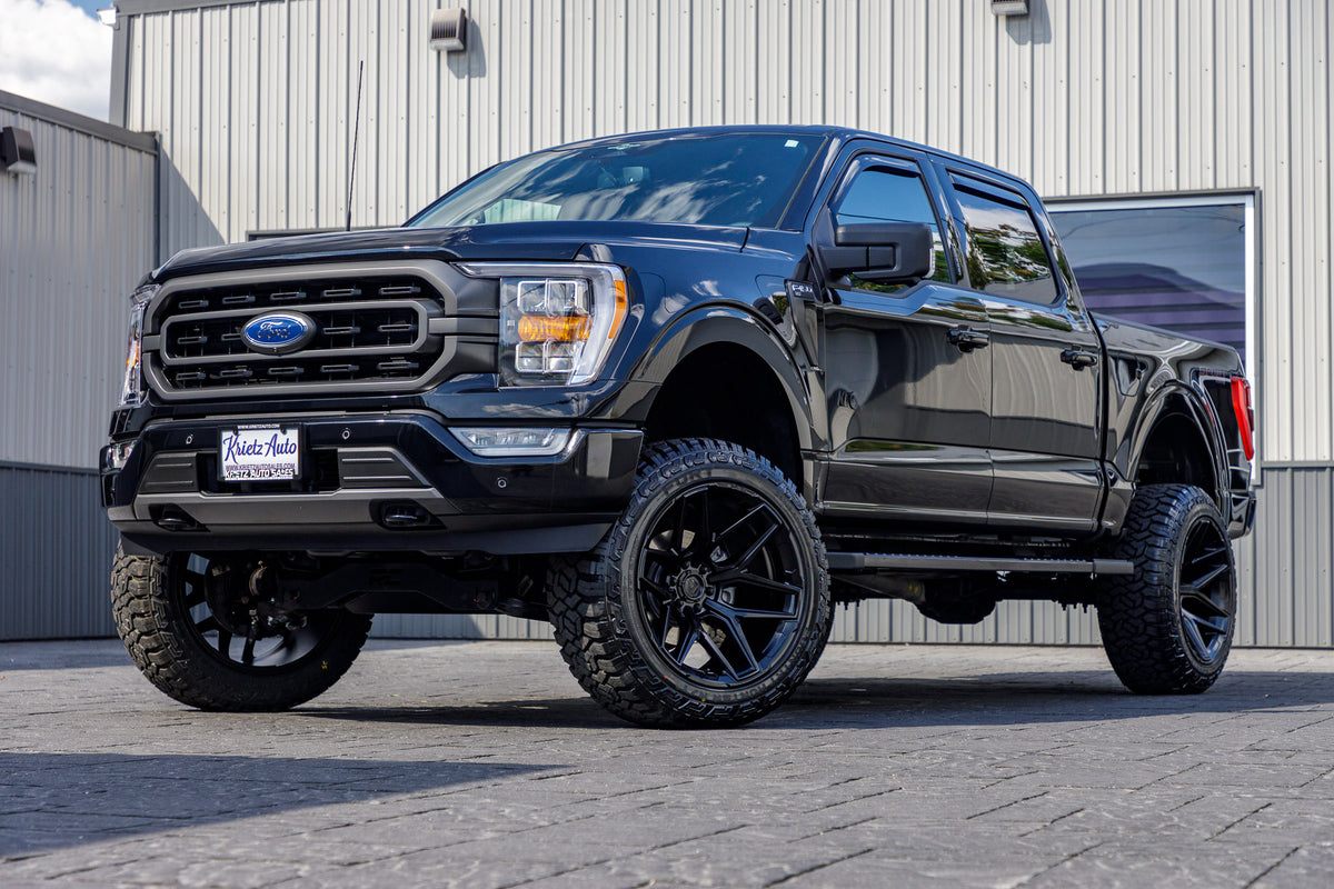2023 Ford F-150 XLT with a 6" Rough Country lift kit, 22x12 Fuel Flux wheels, and 35" Fury Country Hunter R/T tires.