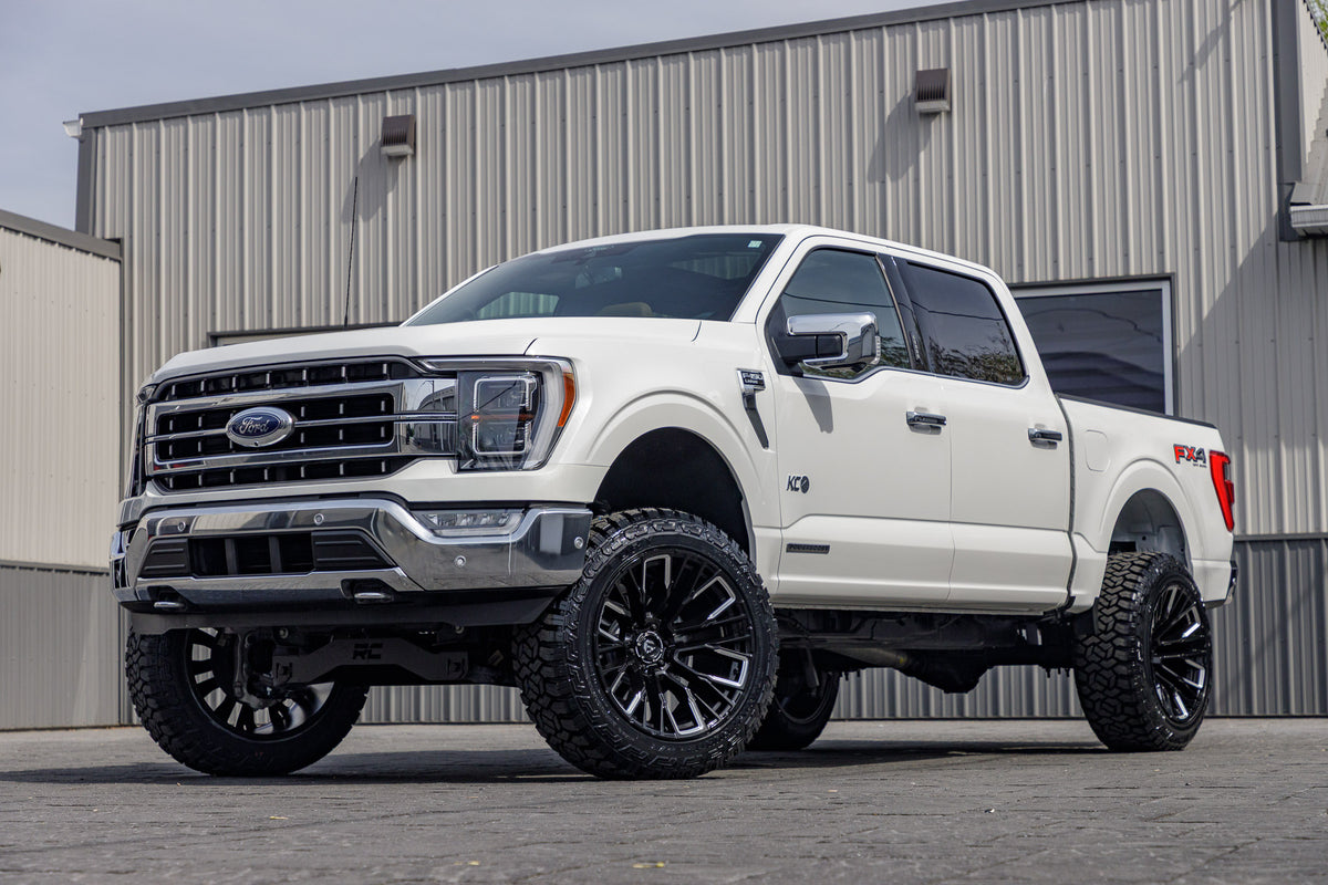 2022 Ford F-150 Lariat with a 6" Rough Country lift kit, 22x12 Fuel Rebar wheels, and 35" Fury Country Hunter R/T tires.