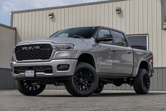 2025 Ram 1500 Lone Star with a 6" Rough Country lift kit, 22x12 Fuel Rebar wheels, and 35" Fury Country Hunter R/T tires.