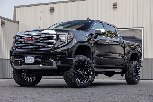 2023 GMC Sierra 1500 Denali with a 6" Rough Country suspension kit, 22x12 Fuel Strike wheels, and 35" Fury Country Hunter R/T tires.