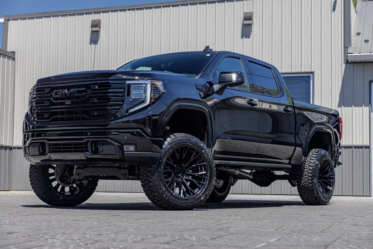 2025 GMC Sierra 1500 AT4 with a 6" Rough Country lift kit, 22x12 Fuel Rebar wheels, and 35" Fury Country Hunter R/T tires.
