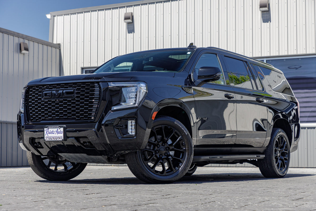 2021 GMC Yukon XL AT4 with GMC Factory Stock, 22x9 GMC Stock wheels, and Bridgestone Alenza tires.