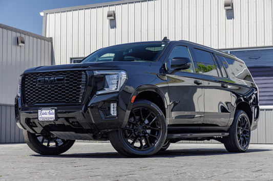 2021 GMC Yukon XL AT4 with GMC Factory Stock, 22x9 GMC Stock wheels, and Bridgestone Alenza tires.