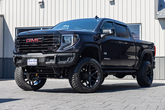 2025 GMC Sierra 1500 AT4X with a 4" ReadyLift lift kit, 22x12 Fuel Flux wheels, and Fury Country Hunter R/T tires.