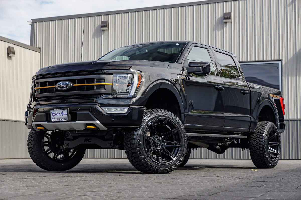 2023 Ford F-150 Tremor with a 6" Rough Country lift kit, 22x12 Fuel Brawl wheels, and 35" Fury Country Hunter R/T tires.