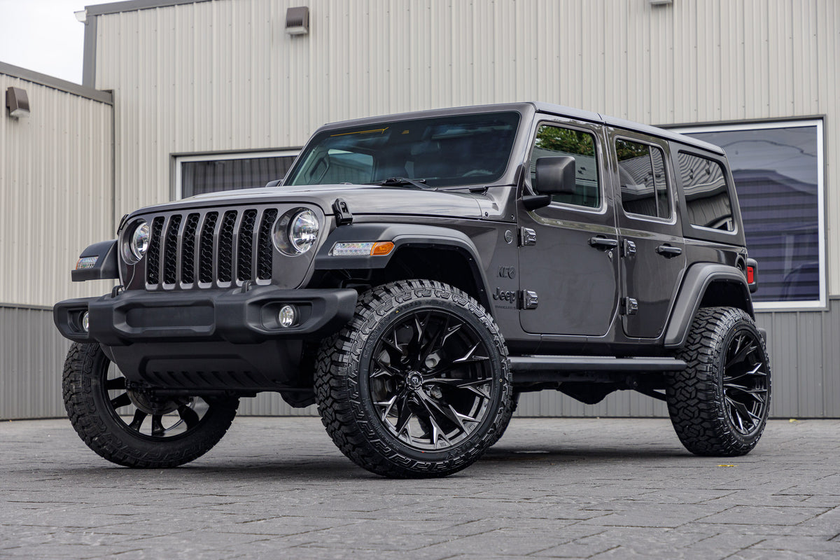 2024 Jeep Wrangler Sport with a 2.5" Rough Country lift kit, 22x12 Fuel Rebar wheels, and 35" Fury Country Hunter R/T tires.